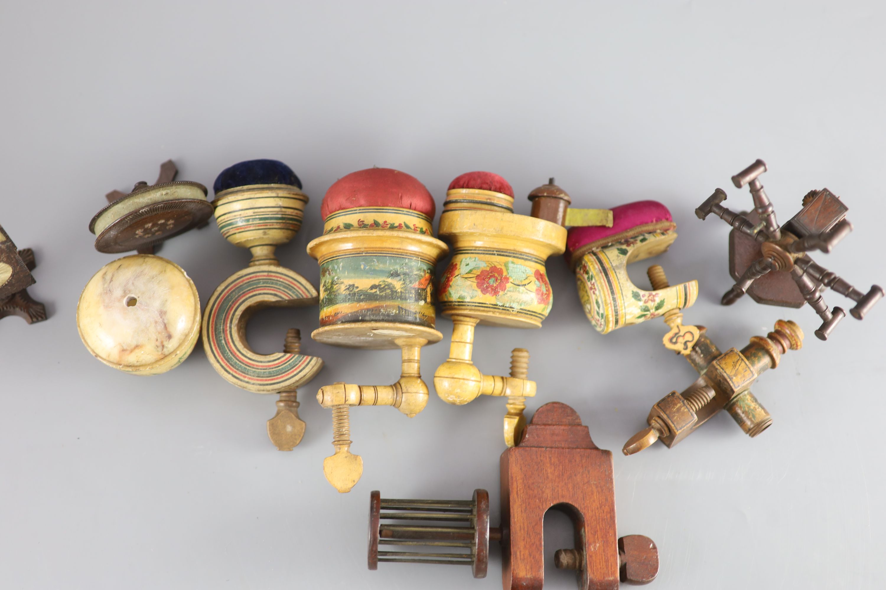 A collection of assorted Victorian sewing clamps and other accessories